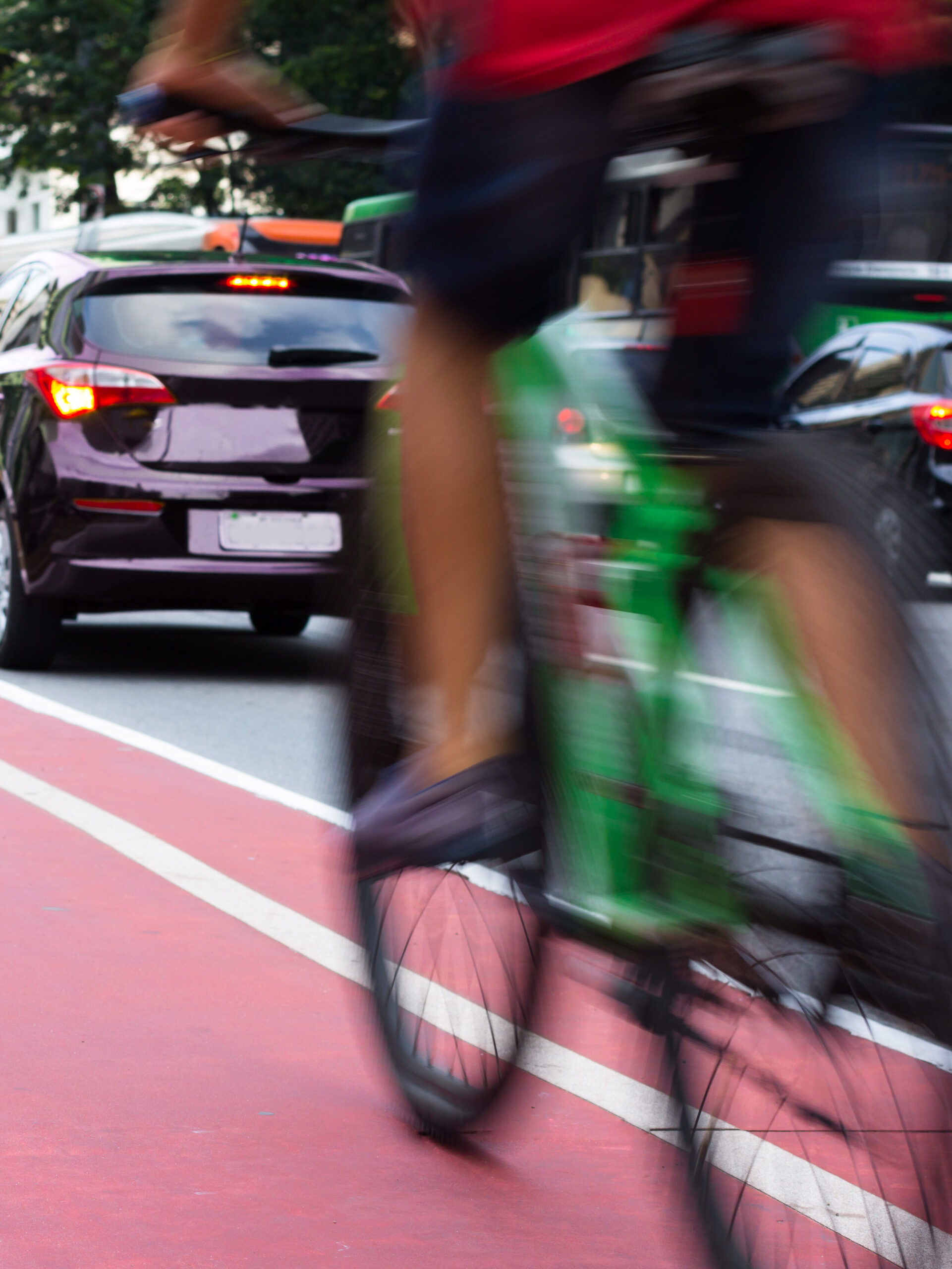 bicyle and cars in downtown area